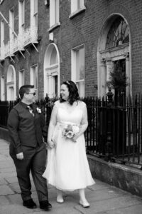 A couple walk through Georgian Dublin during their LGBT Gay wedding