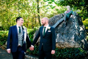 LGBTQ Wedding Photography at the statue of Oscar Wilde in Merrion Square park in Dublin