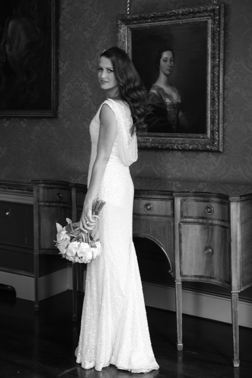 The bride poses for a wedding photograph in The Constitution Room during her Shelbourne Hotel Wedding 