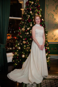 The bride poses by the Christmas tree for Shelbourne Hotel Wedding Photograph