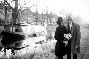 The bride and groom by the banks of the grand canal in a Registry Office Wedding Photograph